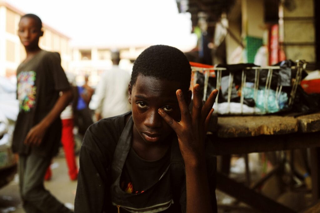 Young sad boy on the street