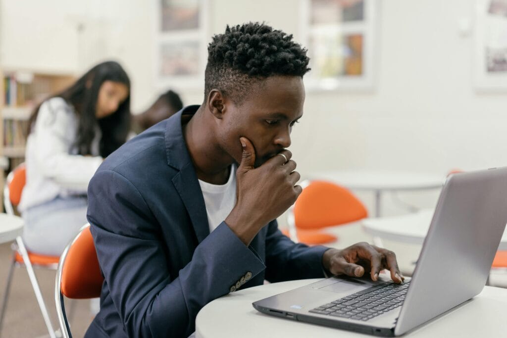 Young man looking at different universities APS score requirements in South Africa