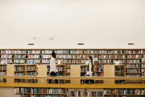 Students studying together in a library, representing collaborative learning and academic success